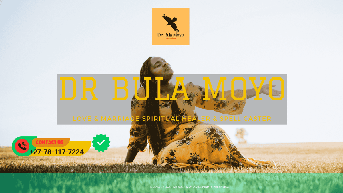 An elderly African spiritual healer holding prayer beads and gazing into the distance. (1)